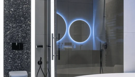 a bathroom with a glass shower door and a tub